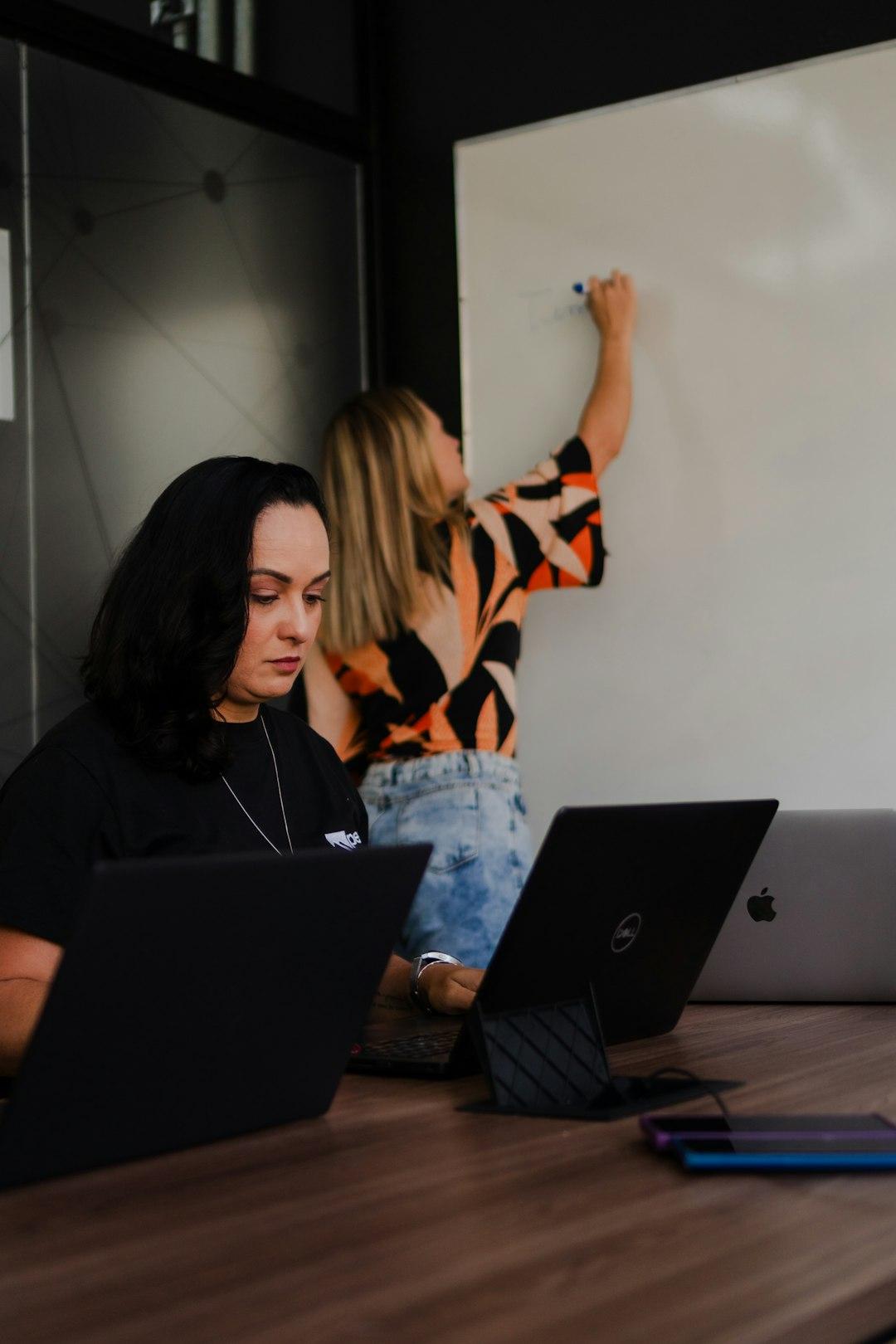 Growing business team reviewing performance together