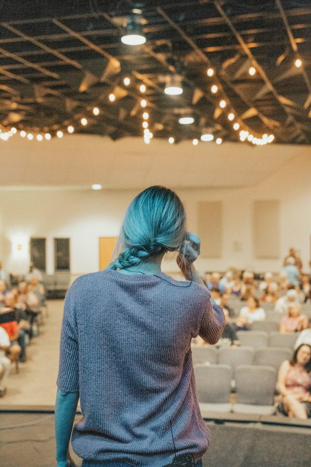 Speaker presenting to a large audience