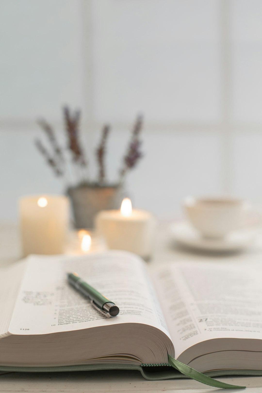 An open journal and Scripture in warm natural light