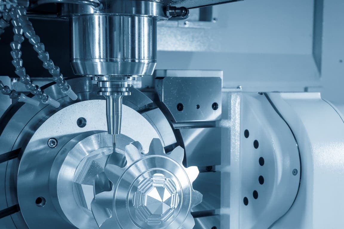 Machinist reviewing machining centre setup