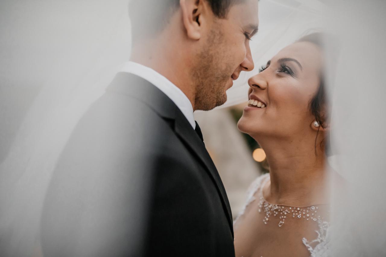 A couple at an elegant outdoor wedding venue