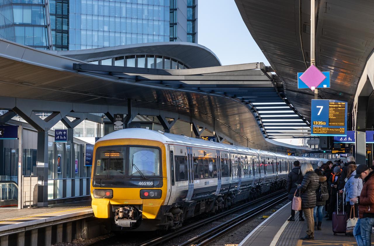 Commuters crossing a London station concourse