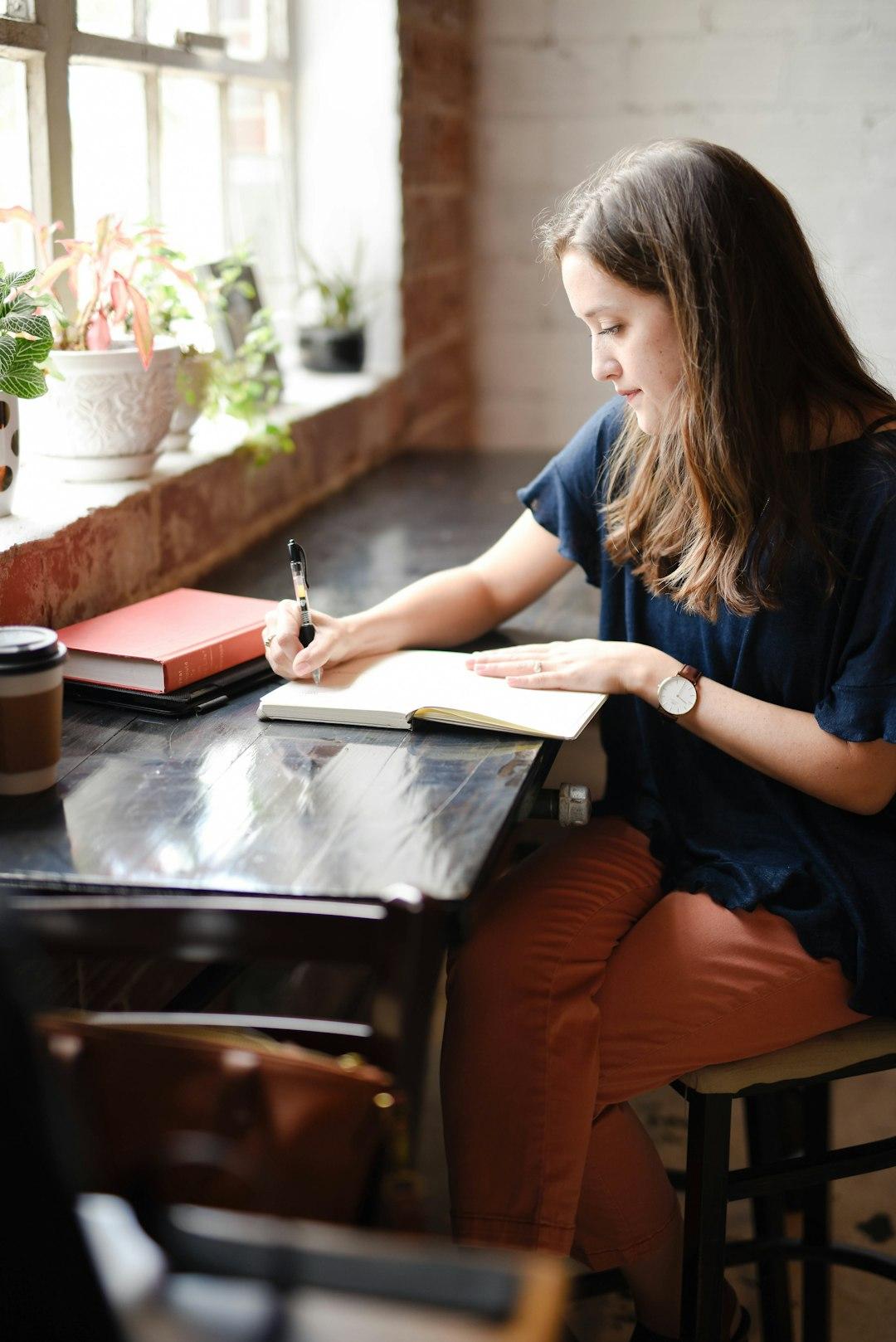 A professional reviewing notes at a table