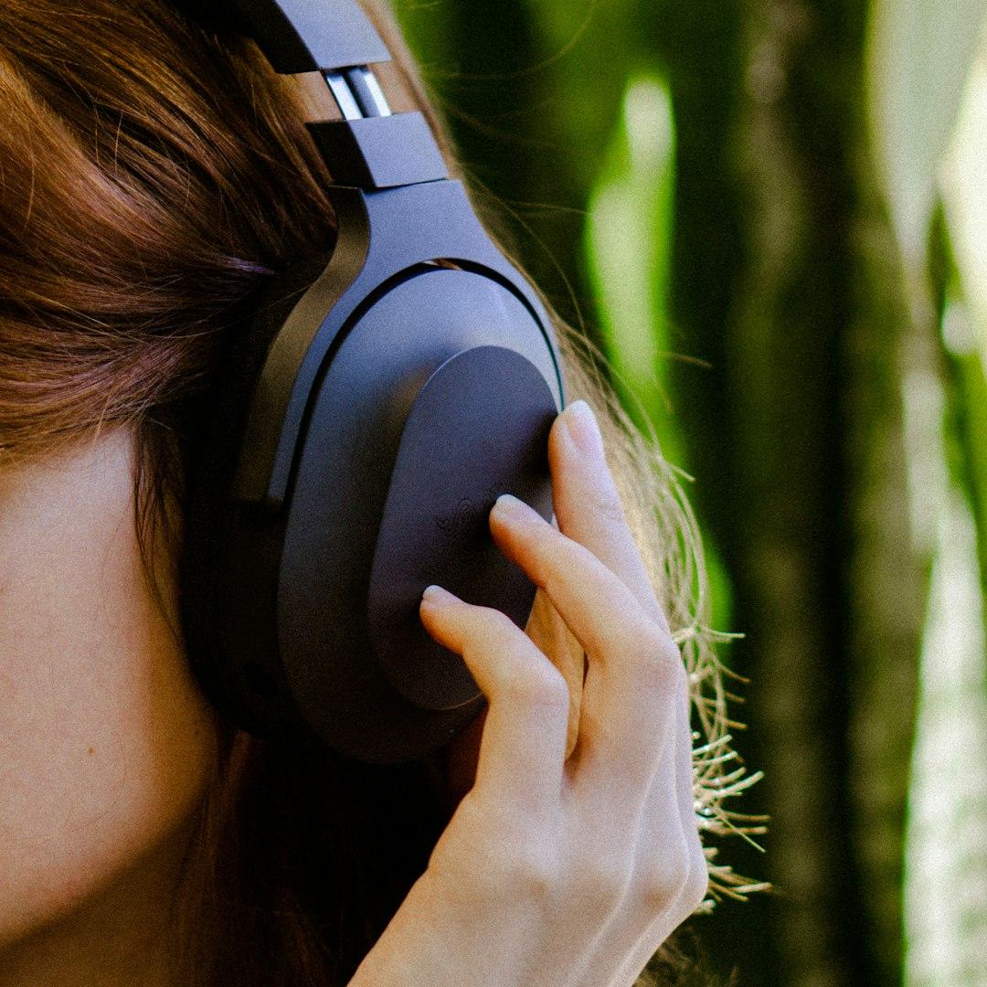 A voice-over artist narrating in headphones