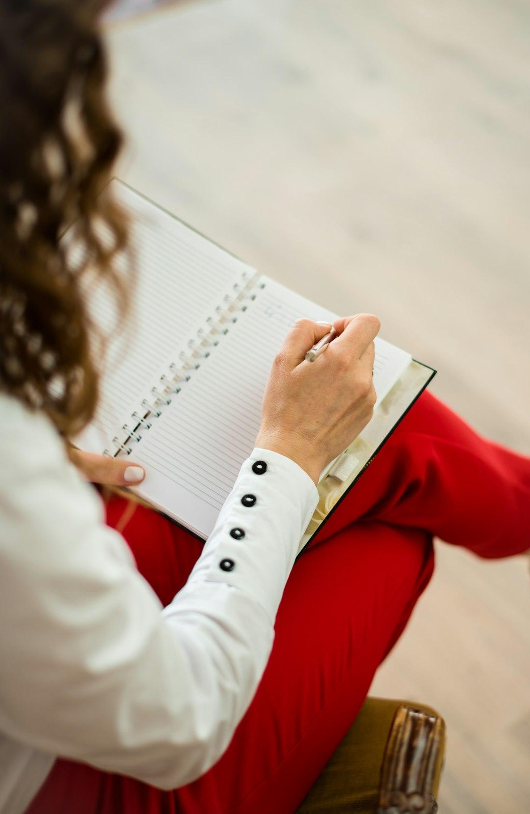 A business owner thinking over notes at a table