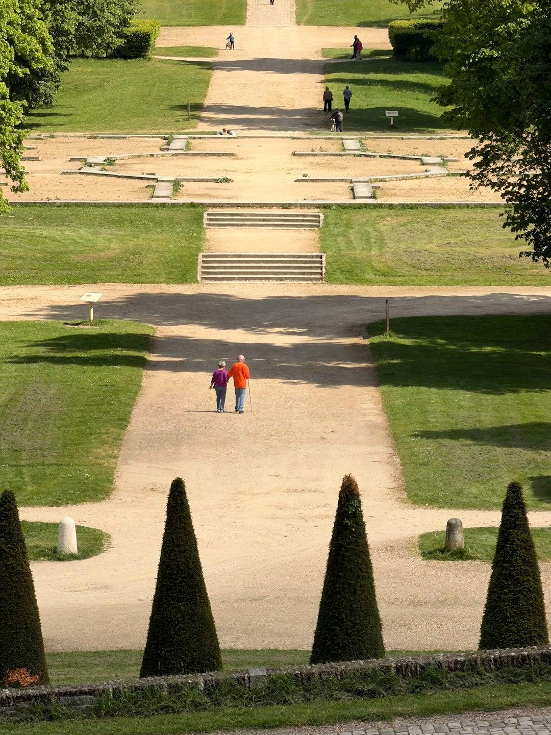 A retired couple walking together outdoors