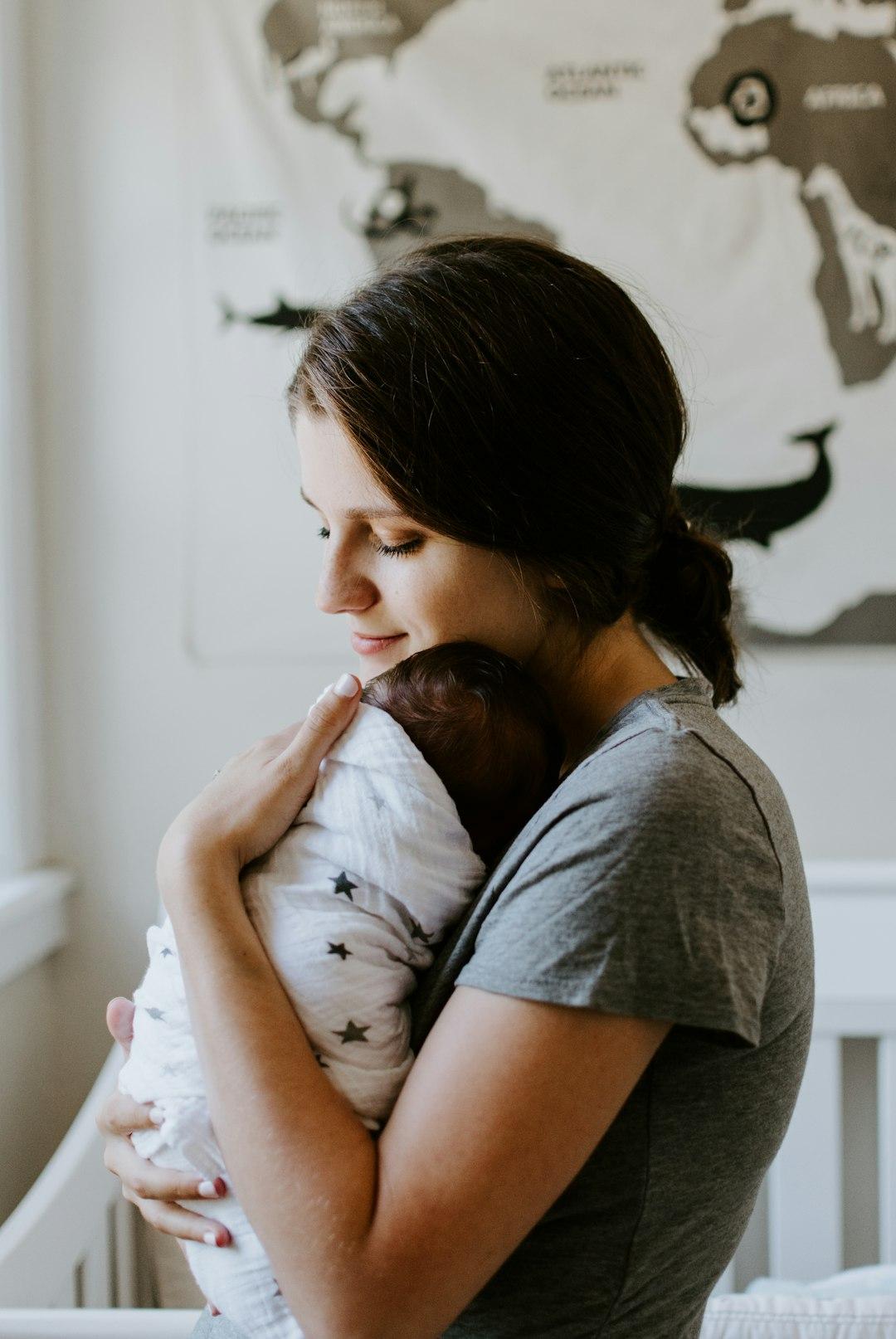 A midwife supporting a mother and newborn soon after birth