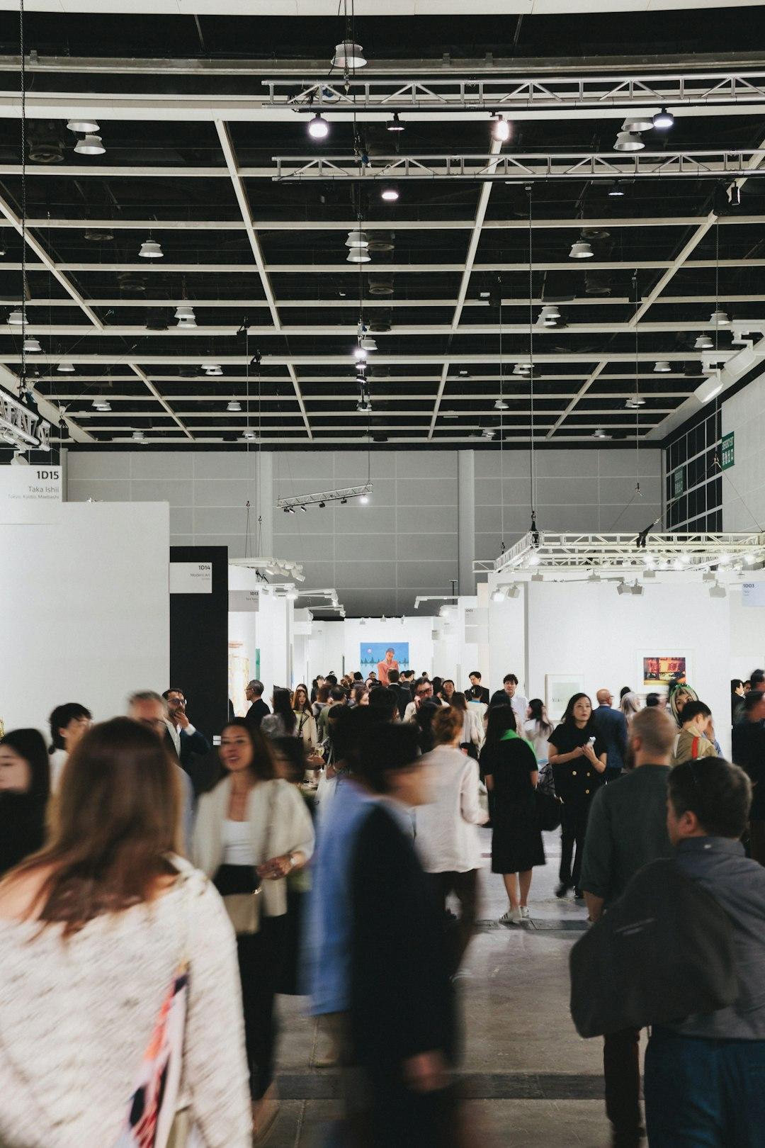 Exhibitors in conversation at a busy trade show stand