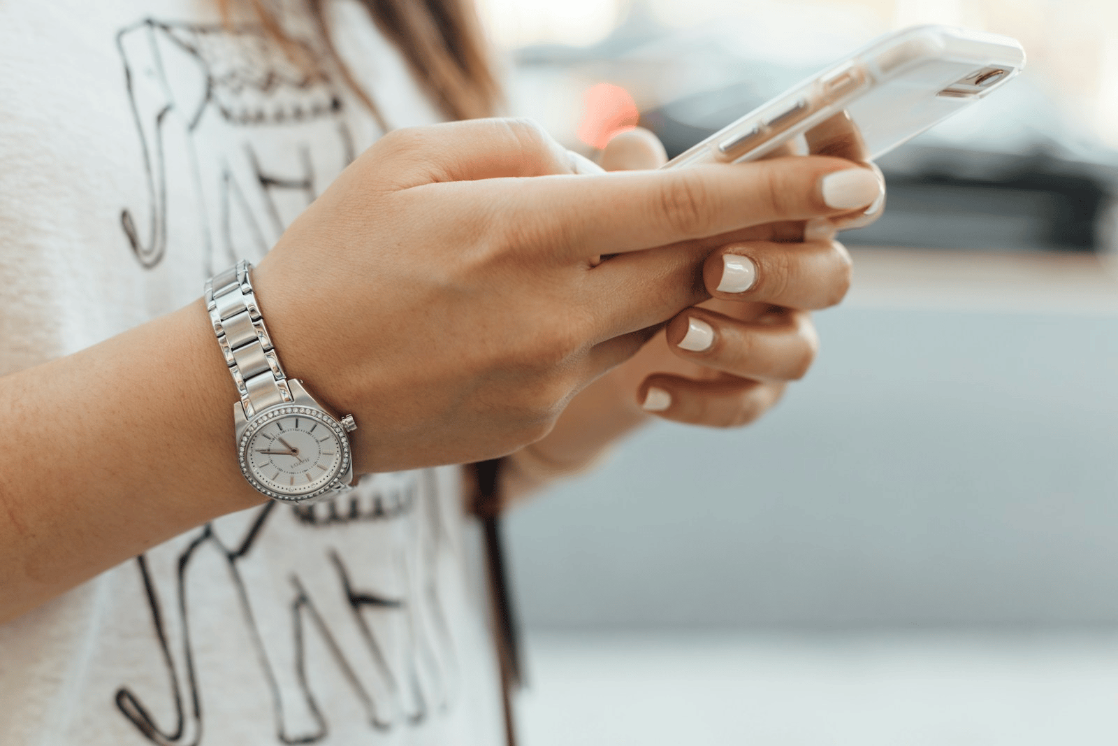 Hands holding phone, making arrangements for a call with Control Risks ONE