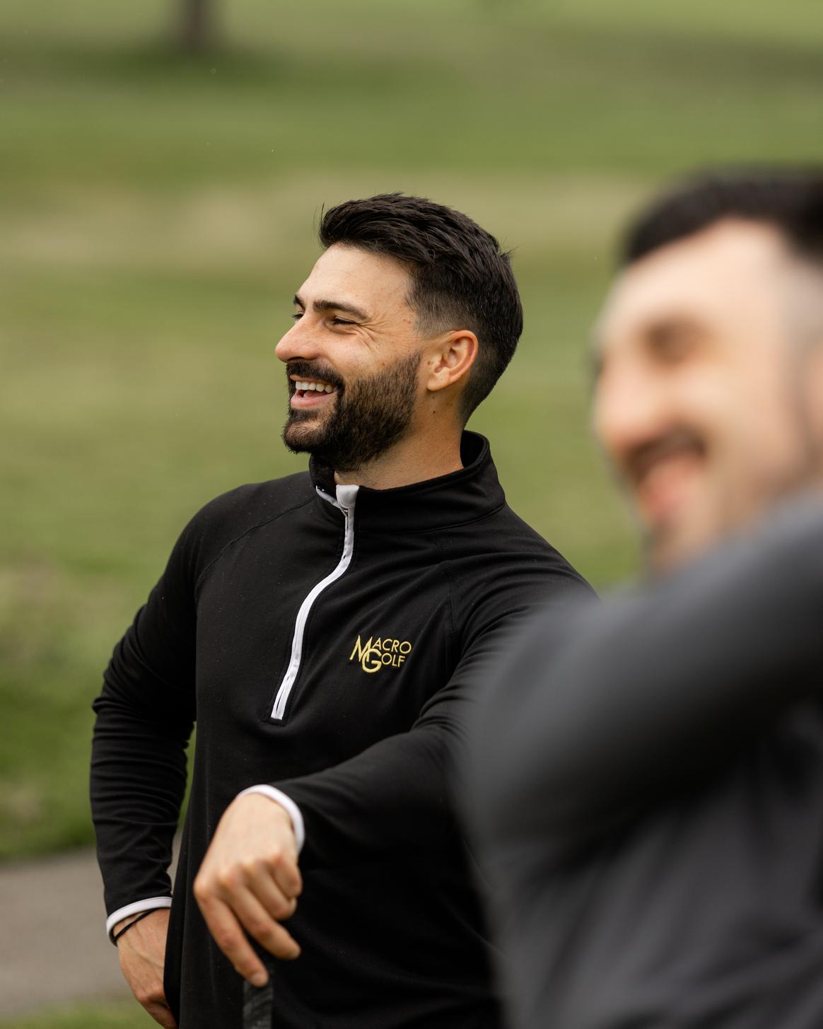 Coach and golfer working together
