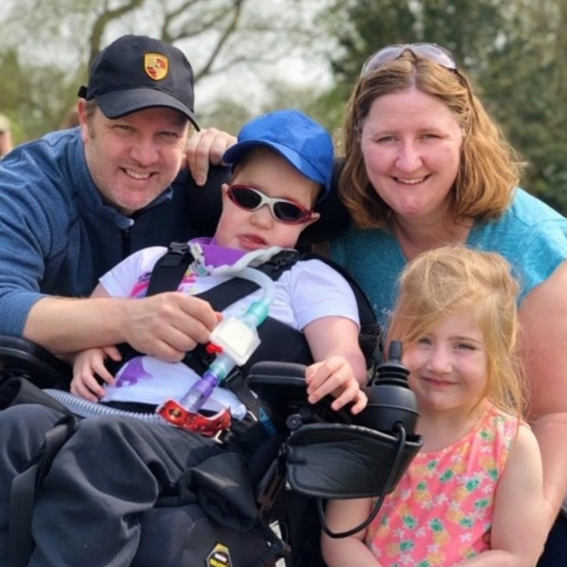 Family of a life-limited child smiling together