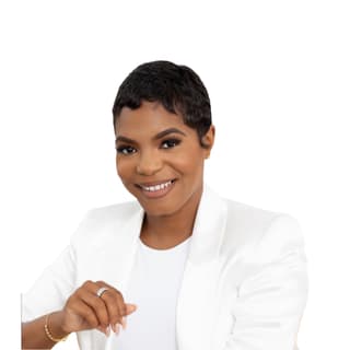 Headshot of Brittni Bee Brown, entrepreneur and business professional, smiling against a neutral background.