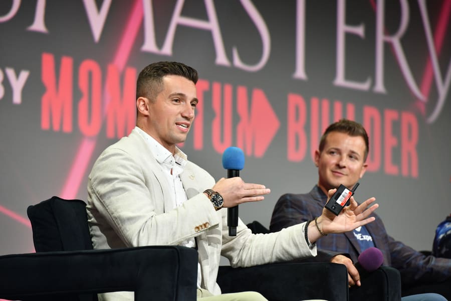 Speaking on a conference panel at Mastery by Momentum Builder