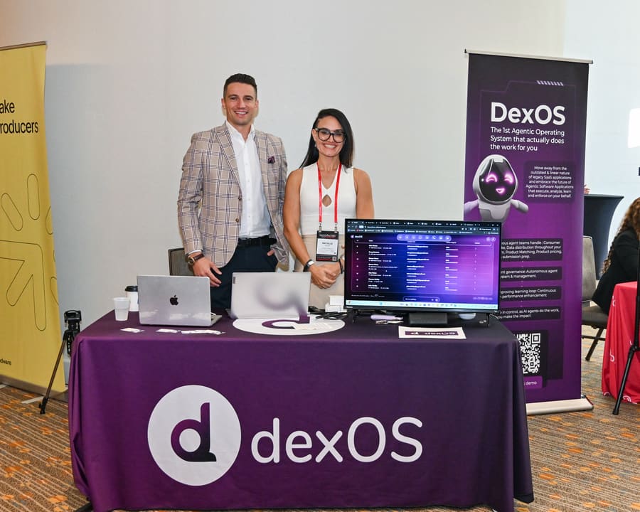 Two team members at the dexOS product booth at an industry expo