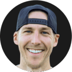 Smiling man wearing a backwards baseball cap, circular headshot photo